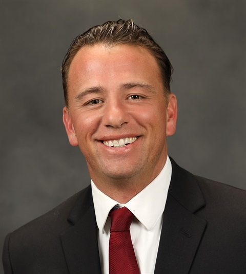A portrait picture of Council Member Mike Frost with a gray background behind